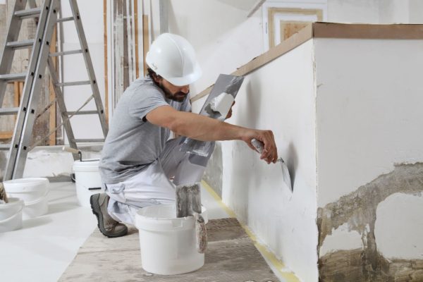 Man Plastering Wall Image