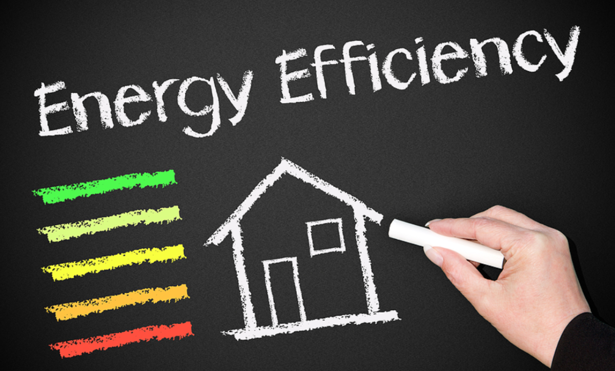 chalkboard with home and text - energy savings through exterior stucco