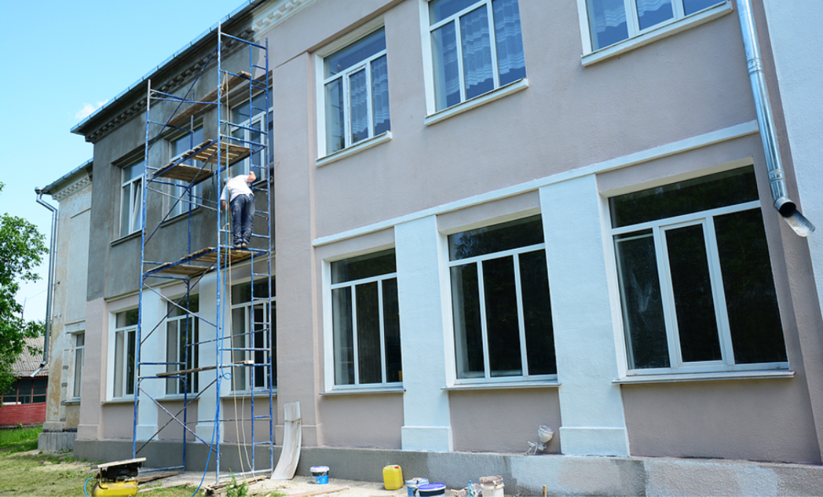 Stucco exterior wall showing signs of damage and repair considerations on a residential home