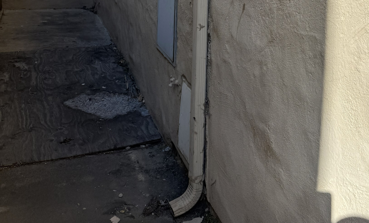 Water intrusion damage on a stucco wall showing cracks, staining, and moisture-related deterioration requiring professional stucco repair.